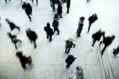 Photo of the public walking around in an urban setting